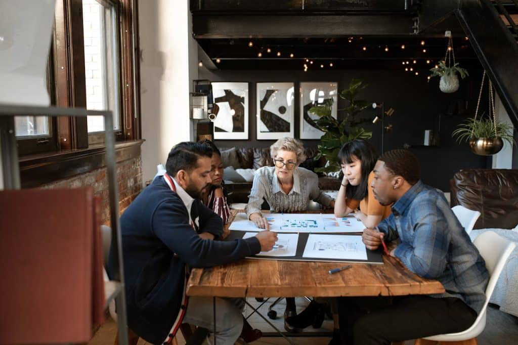 People in a Meeting Discussing Documents